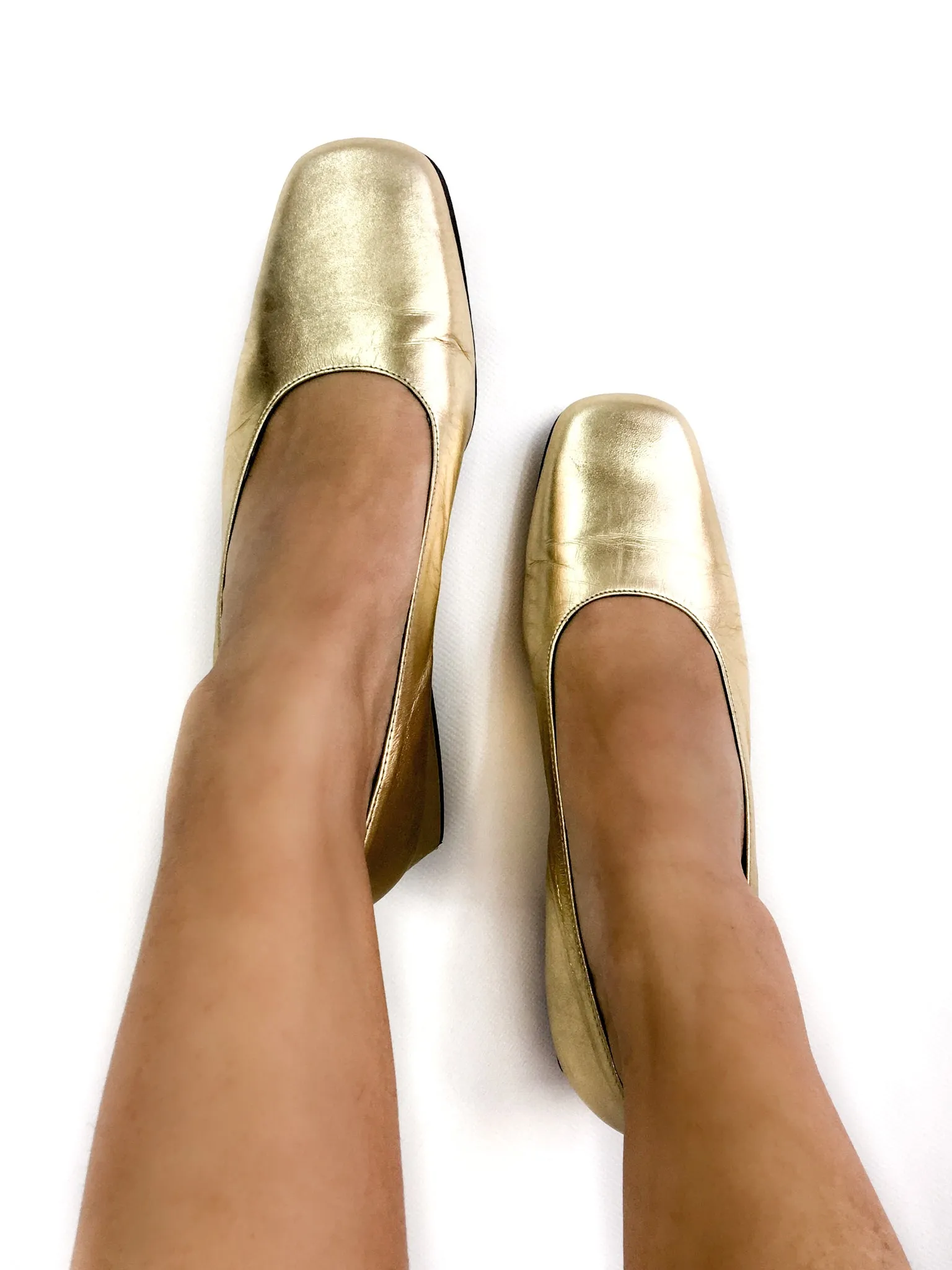 90s vintage gold lamé pumps.