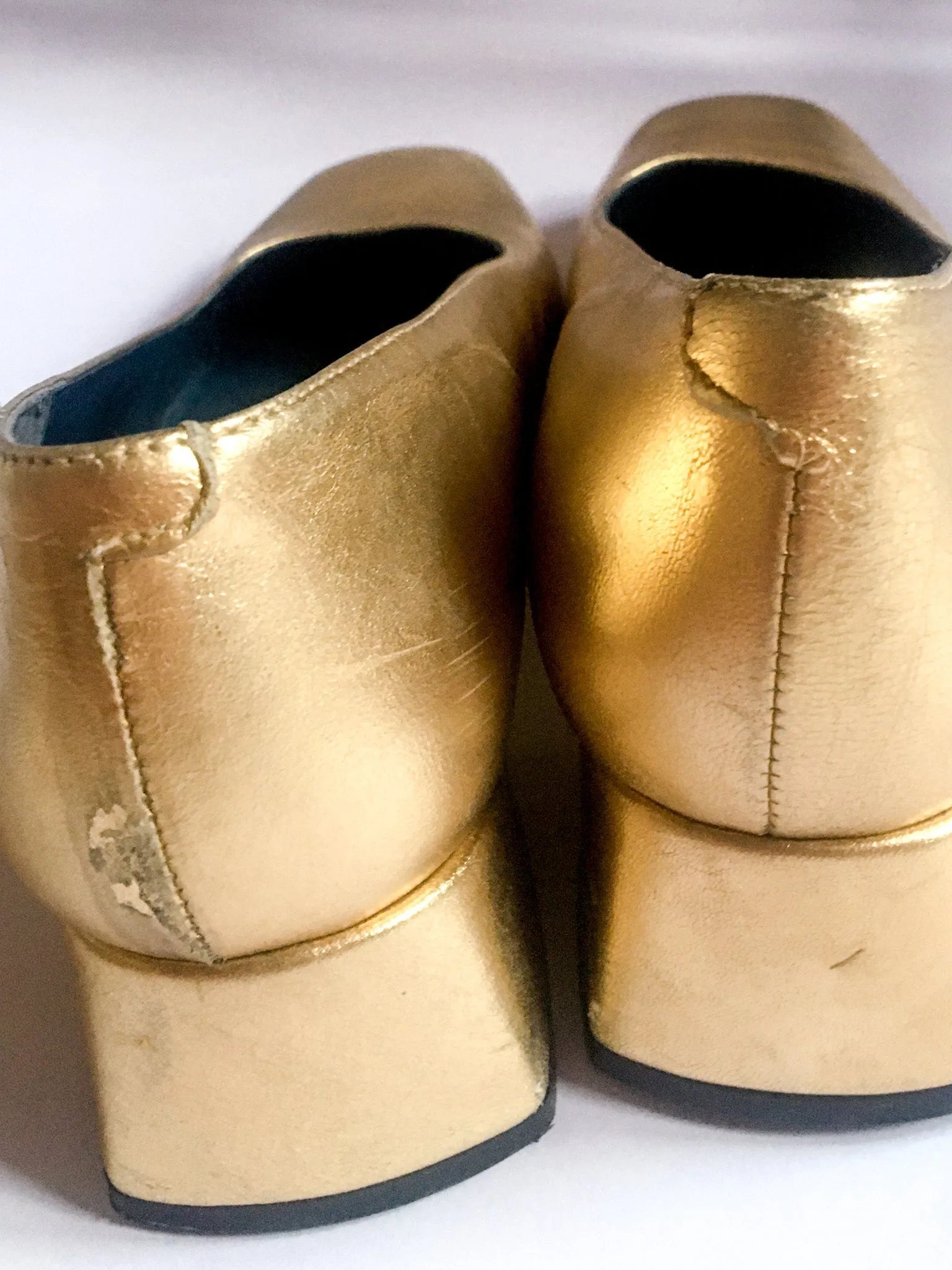 90s vintage gold lamé pumps.